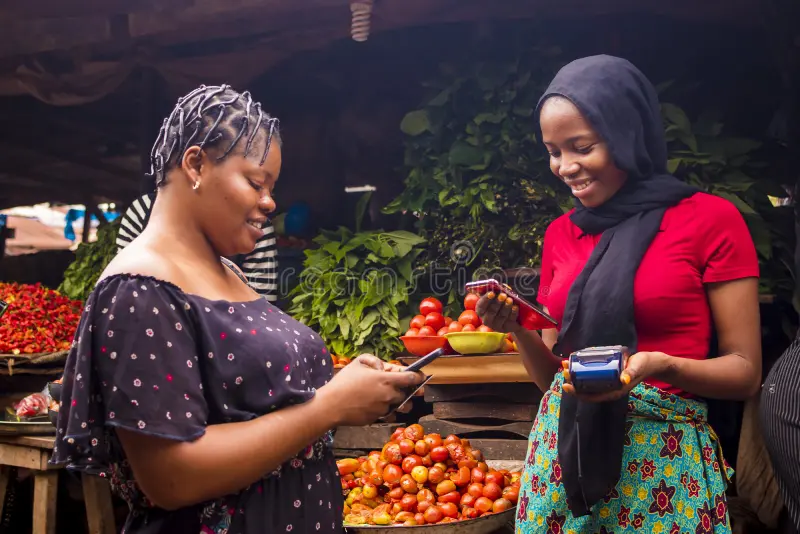 African woman shopping food at local market
